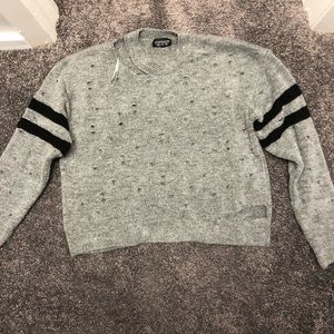 Cropped, ripped sweater